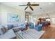 Open-concept living area with hardwood floors, a cozy seating area, and seamless access to the kitchen at 3551 Ridgeland Ct, Punta Gorda, FL 33982
