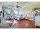 Spacious main bedroom features a tray ceiling, ceiling fan and large windows at 3551 Ridgeland Ct, Punta Gorda, FL 33982