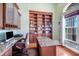 Well-appointed home office with built-in cabinets, granite counters and hardwood floors at 3551 Ridgeland Ct, Punta Gorda, FL 33982