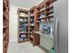 Well-organized walk-in pantry with custom shelving and ample storage space at 3551 Ridgeland Ct, Punta Gorda, FL 33982