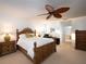 Comfortable bedroom featuring a decorative ceiling fan and ample natural light, creating a relaxing atmosphere at 3922 Wilshire Cir # 177, Sarasota, FL 34238