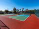 Outdoor pickleball courts feature a vibrant red and green surface, perfect for recreational play at 3922 Wilshire Cir # 177, Sarasota, FL 34238