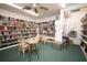 Cozy library with bookshelves, comfortable seating, and soft lighting for reading and relaxation at 4216 El Dorado Cv, Bradenton, FL 34210