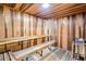 Cozy sauna with wooden benches and striped-panel walls for a relaxing experience at 4216 El Dorado Cv, Bradenton, FL 34210
