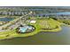 Gorgeous aerial view of the community with waterfront properties, pool, playground and other amenities at 4253 Pond Brook Ct, Bradenton, FL 34211