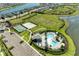 Beautiful aerial view of community amenities featuring pool, playground, volleyball court, parking at 4253 Pond Brook Ct, Bradenton, FL 34211