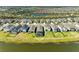 Beautiful aerial view of home, backyard with pool and community on the water at 4253 Pond Brook Ct, Bradenton, FL 34211