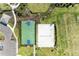 Top-down view of basketball court, beach volleyball court, parking lot and landscaped grounds at 4253 Pond Brook Ct, Bradenton, FL 34211