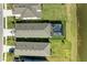 An aerial view of the backyard with a screened pool overlooking a scenic pond at 4253 Pond Brook Ct, Bradenton, FL 34211