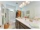 Bright bathroom featuring double sinks, and a shower-tub combo at 4253 Pond Brook Ct, Bradenton, FL 34211