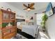 Charming bedroom with a wooden cabinet, ceiling fan, and comfortable bed at 4253 Pond Brook Ct, Bradenton, FL 34211