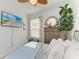 Bright bedroom with decorative ceiling fan, TV, and comfortable furnishings at 4253 Pond Brook Ct, Bradenton, FL 34211