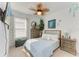 Inviting bedroom with decorative ceiling fan, soft lighting, and comfortable furnishings at 4253 Pond Brook Ct, Bradenton, FL 34211