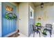Inviting front door area with a nautical theme, decorative wreath, and cozy seating at 4253 Pond Brook Ct, Bradenton, FL 34211