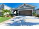 Charming single-story home showcasing a well-manicured lawn and lush landscaping at 4253 Pond Brook Ct, Bradenton, FL 34211