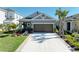 Charming single-story home featuring a well-manicured lawn and a two-car garage at 4253 Pond Brook Ct, Bradenton, FL 34211
