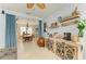 Inviting living area with a dining area, exposed beams, decor, and furnishings at 4253 Pond Brook Ct, Bradenton, FL 34211