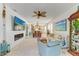 Spacious living room featuring stylish furnishings, an electric fireplace, decor, and an open view to the dining area at 4253 Pond Brook Ct, Bradenton, FL 34211
