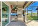 Outdoor kitchen with a stainless steel grill and vent hood for convenient outdoor cooking at 4253 Pond Brook Ct, Bradenton, FL 34211