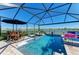 Stunning screened-in pool area with ample seating and a picturesque waterfront view at 4253 Pond Brook Ct, Bradenton, FL 34211