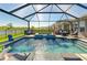Wonderful screened-in pool and spa with multiple seating areas and lush landscaping at 4253 Pond Brook Ct, Bradenton, FL 34211