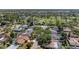 Aerial view highlighting a lovely home surrounded by lush landscaping and golf course at 4283 Southwell Way, Sarasota, FL 34241