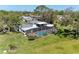 Aerial view of the home, pool, patio, and large private yard at 4283 Southwell Way, Sarasota, FL 34241