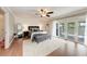 Primary bedroom features updated flooring, light paint, and access to a private balcony at 4283 Southwell Way, Sarasota, FL 34241