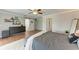 Spacious bedroom with a ceiling fan, modern decor, and an attached full bathroom at 4283 Southwell Way, Sarasota, FL 34241