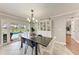 Bright dining room with views of the pool and patio through sliding glass doors at 4283 Southwell Way, Sarasota, FL 34241