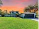 Charming two-story home with a well-manicured lawn and attached two car garage at 4283 Southwell Way, Sarasota, FL 34241