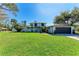 Charming two-story home with well-maintained lawn, blue door, and attached garage at 4283 Southwell Way, Sarasota, FL 34241