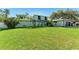 Charming two-story home with well-maintained lawn, blue door, and attached garage at 4283 Southwell Way, Sarasota, FL 34241