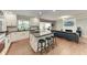 Bright and airy kitchen featuring a large island, modern appliances, and a view into the living room at 4283 Southwell Way, Sarasota, FL 34241