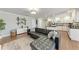 Stylish living room with an open kitchen, modern decor, and ample natural light at 4283 Southwell Way, Sarasota, FL 34241
