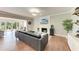 Cozy living room with a stone fireplace, modern decor, and a seamless transition to the outdoor space at 4283 Southwell Way, Sarasota, FL 34241