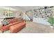 Inviting living room featuring a leather sofa, open layout, and built-in bookshelves, perfect for relaxation at 4283 Southwell Way, Sarasota, FL 34241