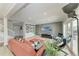 Spacious living room featuring a large TV, comfortable seating, and bright natural light at 4283 Southwell Way, Sarasota, FL 34241