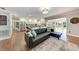 Open-concept living room and kitchen with stainless steel appliances and modern fixtures at 4283 Southwell Way, Sarasota, FL 34241