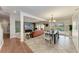 The home features an open layout with a dining area connected to the living room and pool views at 4283 Southwell Way, Sarasota, FL 34241