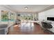 Bright home office featuring beautiful wood floors, large windows, and access to the pool at 4283 Southwell Way, Sarasota, FL 34241