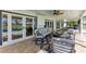 Enjoy the shaded covered patio with comfortable seating for relaxing and entertaining at 4283 Southwell Way, Sarasota, FL 34241