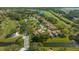 Community aerial view overlooking manicured golf course, community ponds and tile roof homes at 4404 Calle Serena, Sarasota, FL 34238