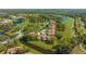 Aerial view of the property showcasing community ponds and beautiful golf course at 4404 Calle Serena, Sarasota, FL 34238