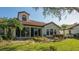Home featuring large sliding glass doors and a red tile roof at 4404 Calle Serena, Sarasota, FL 34238