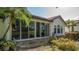 Backyard featuring a patio with large sliding glass doors to bring the outside in at 4404 Calle Serena, Sarasota, FL 34238