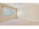 Neutral bedroom featuring plush carpet, light walls, and a bright window at 4404 Calle Serena, Sarasota, FL 34238