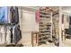Organized walk-in closet with shelving, providing ample storage space for clothes and accessories at 4404 Calle Serena, Sarasota, FL 34238