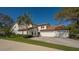 Exterior of a well maintained two-story home with a two-car garage and tile roof at 4404 Calle Serena, Sarasota, FL 34238