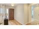 Welcoming foyer with gleaming hardwood floors and views of the home's interior at 4404 Calle Serena, Sarasota, FL 34238
